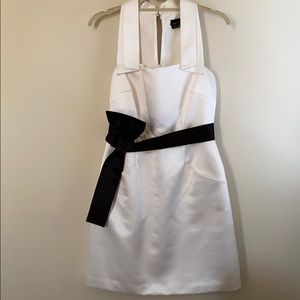 White satin semi formal dress with satin tie belt.